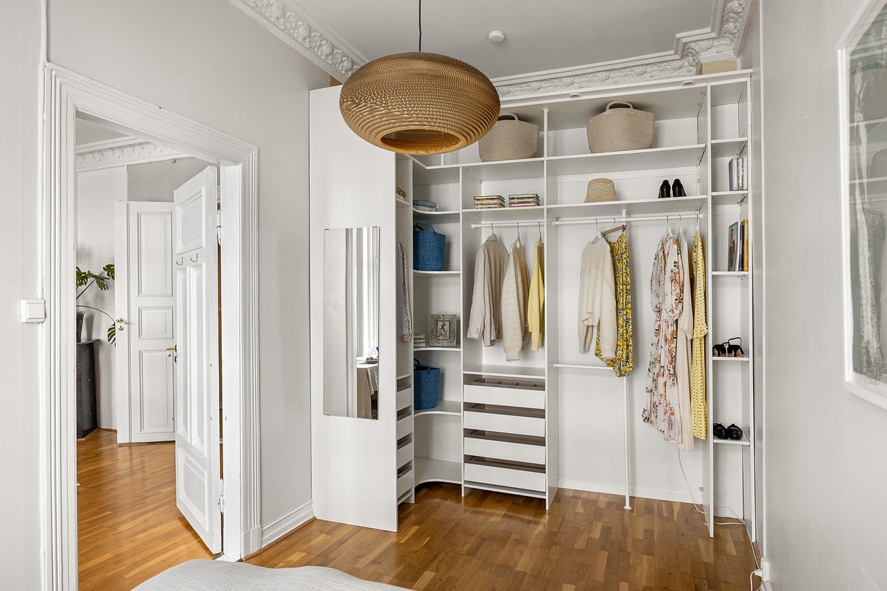 Built-in wardrobe with mirrored doors in a luxury bedroom
