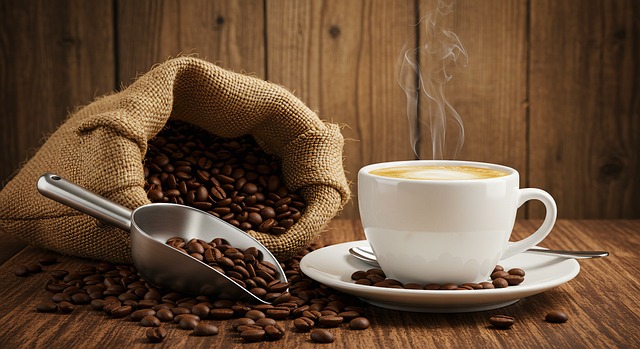 Free open jute bag coffee beans steaming cup illustration