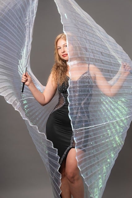 dancer, wings, costume, transparent, sparkling, dress, evening dress, gray background, woman, adult, fashionable, artistic, posing, hands, light, pleated, fantasy, traditional dance, attractive, striking