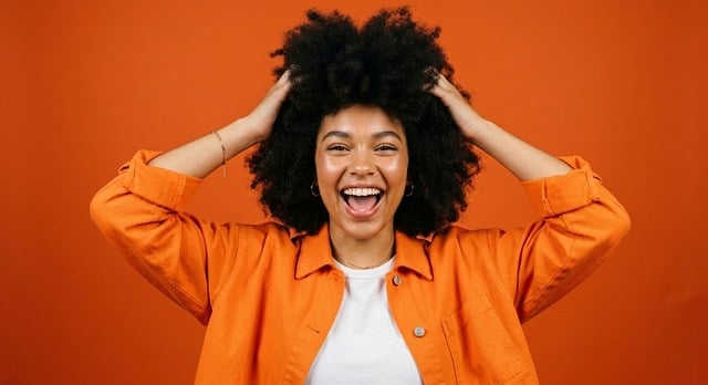 Free young woman natural afro hair bold orange background illustration