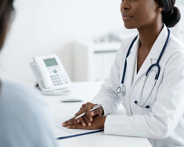 doctor, woman, female, black, african american, medical, healthcare, consultation, patient, office, clinic, professional, white coat, stethoscope, pen, clipboard, desk, attentively, medicine, ai generated