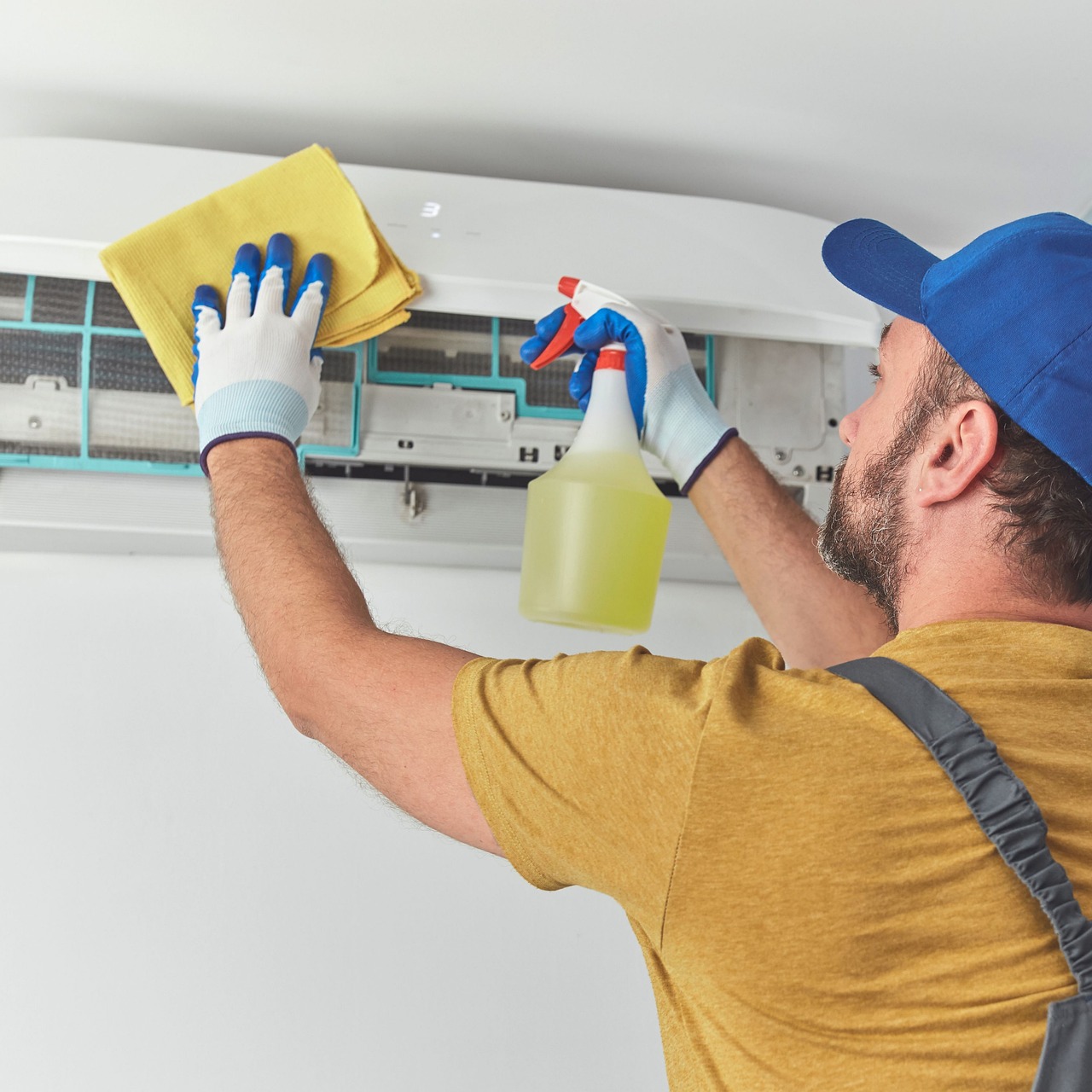 AC technician repairing an air conditioner