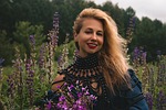 Random: woman, beautiful flowers, summer, fashion, style, model, posing, flowers, flower wallpaper, field, nature, necklace, smile, lupine, mature, flower background, portrait, beauty, confidence, blonde, femininity, look, classic
