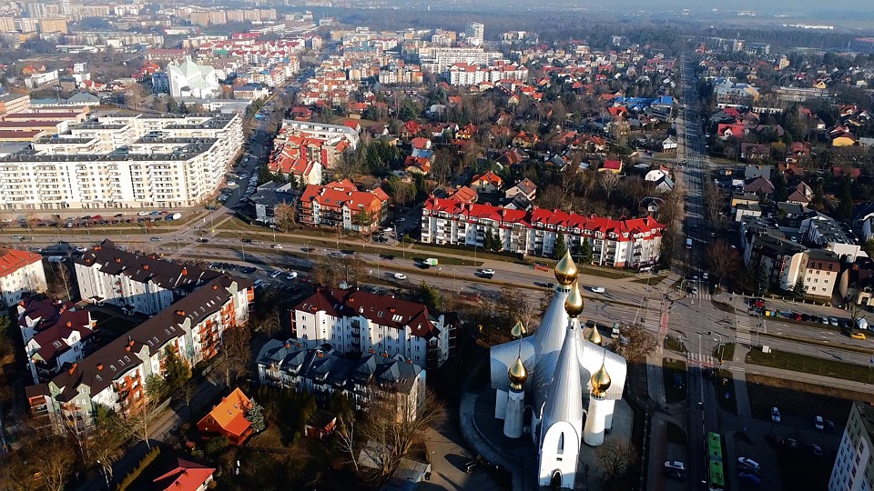cityscape, aerial view, drone shot, urban landscape, skyline, city skyline, downtown, metropolis, city streets, traffic, cars, road, nature, landscape, scenic view, aerial footage, modern city, urban scene