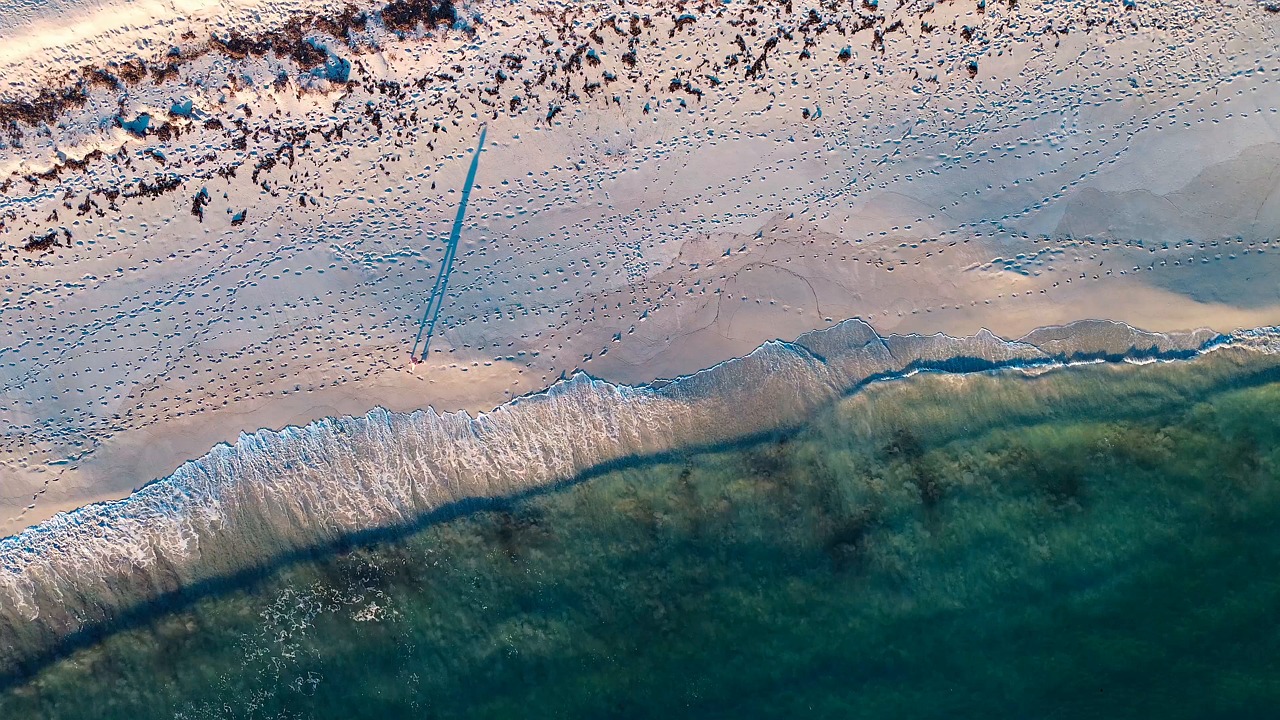 drone, footage, nature, camera, landscape, beach, videography, person, human, walking, coast, water, sea, waves, sand